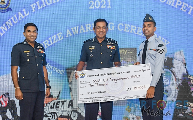 FLIGHT SAFETY POSTER COMPETITION WINNERS RECEIVE AWARDS FROM THE COMMANDER