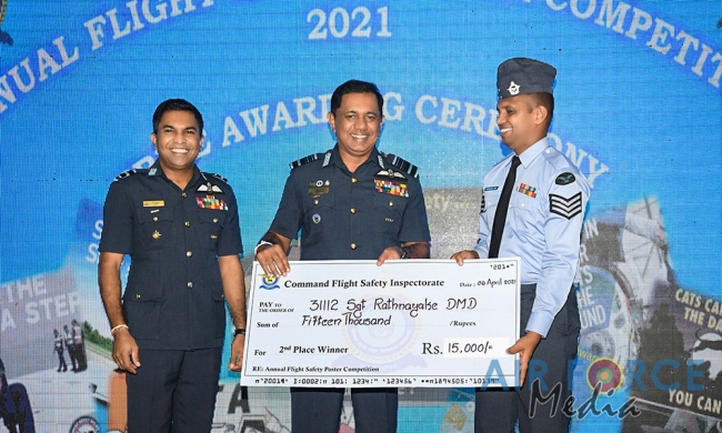 FLIGHT SAFETY POSTER COMPETITION WINNERS RECEIVE AWARDS FROM THE COMMANDER
