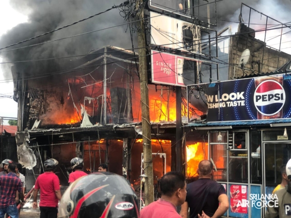 SLAF
ASSISTS IN EXTINGUISHING FIRE AT SINGER SHOWROOM IN VAVUNIYA