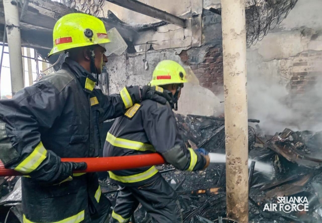 SLAF
ASSISTS IN EXTINGUISHING FIRE AT SINGER SHOWROOM IN VAVUNIYA