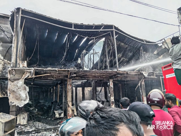 SLAF
ASSISTS IN EXTINGUISHING FIRE AT SINGER SHOWROOM IN VAVUNIYA