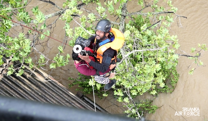 SLAF BELL
212 RESCUES THREE PERSONS STRANDED BY FLOODS IN MAHAWA (ELLA)