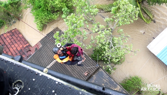 SLAF BELL
212 RESCUES THREE PERSONS STRANDED BY FLOODS IN MAHAWA (ELLA)