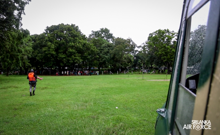 SLAF BELL
212 RESCUES THREE PERSONS STRANDED BY FLOODS IN MAHAWA (ELLA)